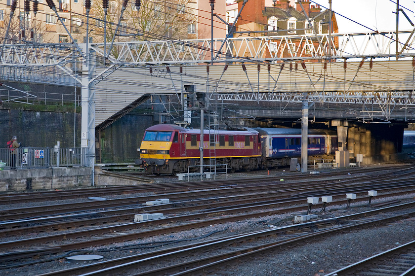 90028, SR 21.43 Aberdeen, 20.44 Inverness & 19.50 Fort William-London Euston sleeper (1M16), London Euston station 
 The 1M16 Highland Sleeper arrives at Euston after its overnight journey from Scotland. The 21.43 Aberdeen, 20.44 Inverness and 19.50 Fort William sleeper is a complicated train with all three portions having to come together in order for all portions to make it to the capital on time. On this bright winter's morning, 90028 brings the ensemble into its destination with the passengers hopefully awake and ready to disembark from their cabins. 
 Keywords: 90028 21.43 Aberdeen 20.44 Inverness 19.50 Fort William-London Euston sleeper 1M16 London Euston station Caledonian Sleeper Highland Sleeper