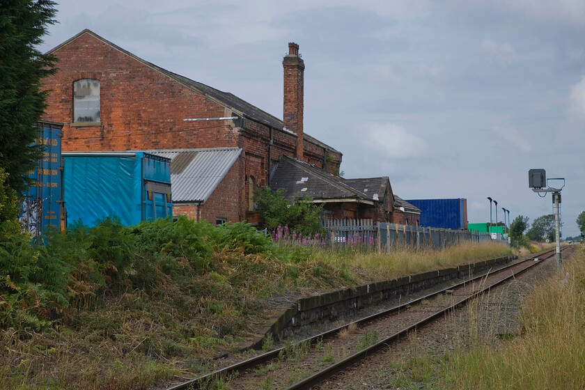 Midge Hall station (Closed 02.10.61) 
 The remains of Midga Hall station with the down platform still extant. The station was closed in October 1961 but there are regular reports and discussions about its possible reopening to serve the fast-growing western flank of Leyland. This case would be helped massively if the direct route into the Merseyrail network could be restored at Ormskirk where the lines are separated by a pair of buffer stops and a gap of a few metres. 
 Keywords: Midge Hall station