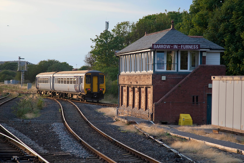 156443, NT 20.20 Barrow-in-Furness-Carlisle (2C51, 4L), Barrow-in-Furness signal box (Furness, 1907) 
 The last time I visited Barrow I was afforded a visit into the signal box. I also saw a class 25 working an ICI weedkilling train passing through the station, all this back in October 1985. A glint shot as 156443 leaves the station past the 1907 built Furness signal box forming the 20.20 Barrow-in-Furness to Carlisle working. This would be a delightful and dramatic journey along the Cumbrian Coast on a lovely summer's evening such as this. 
 Keywords: 156443 2C51 Barrow-in-Furness signal box