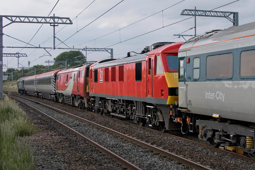 90035, 91128 & 57310, 17.53 Kettering-Bedford (3Q65, RT), Irchester SP927667 
 The rear end of the 17.53 Kettering to Bedford Rail Operations Group (ROG)/Data Acquisition and Testing Services Ltd (DATS) test train passes Irchester. As well as a faithfully re-created delivery liveried Mk.III coach there are two former Virgin 'Pretendolino' coaches with 90035 and 91128 'Intercity 50' sandwiched in between with 57310 'Pride of Cumbria' bringing up the rear. I was a little disappointed that all four runs made on this particular occasion were on the fast lines and with no pantographs raised. 
 Keywords: 90035 91128 57310 17.53 Kettering-Bedford 3Q65 Irchester SP927667 ROG DATS MML Overhead Line Inspection Train Intercity 50