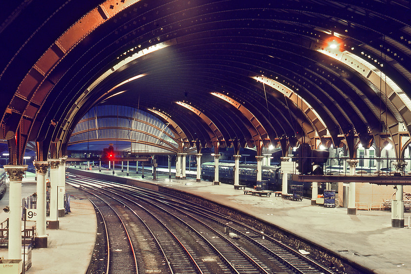 York station, looking North 
 The classic architecture of York station looking north from the station footbridge. In the middle of the night, it is unnervingly quiet with not a soul in sight in this view on platforms eight and nine (now three and five). Notice the profusion of BRUTE and flat trolleys scattered about the platforms and the two DMUs stabled. 
 Keywords: York station looking North