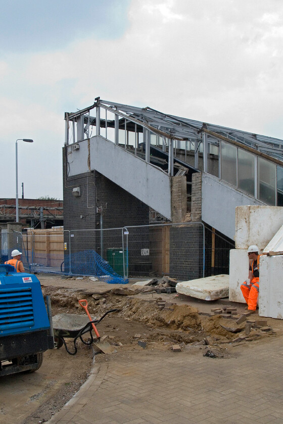 Former footbridge, Northampton station 
 The former station footbridge is seen at Northampton in a state of semi-demolition with the lift towers already removed. The bridge was constructed in 1965 when the station was last comprehensively rebuilt. 
 Keywords: Former footbridge Northampton station