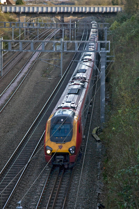 Class 221, 13.43 London Euston-Glasgow Central (6S77), Hyde Road bridge 
 A pair of unidentified Class 221s head north through Roade working the 6S77 13.43 Euston to Glasgow Central. I thought that running a diesel from Birmingham to London under 25Kv wires was a waste (see previous image) what about this one? 
 Keywords: Class 221 13.43 London Euston-Glasgow Central 6S77 Hyde Road bridge Virgin West Coast Voyager