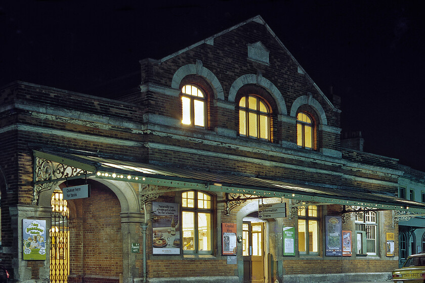 Frontage, Salisbury station 
 On my last visit to Salisbury station just a few days previously, I took a photograph from a very similar angle, see.... https://www.ontheupfast.com/p/21936chg/30035687493/frontage-salisbury-station However, I have always liked nighttime photography and with the use of Graham's sturdy Velbon tripod, I captured this image. Whilst in the daytime photograph a Volvo taxi was waiting to collect passengers this time it's the turn of a Hampshire (Southampton) registered yellow 1977 Triumph Dolomite 1300 that, according to the DVLA records, was last on the road at the end of 1989. 
 Keywords: Frontage Salisbury station Triumph Dolomite