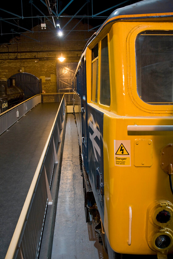 87001, preserved, NRM 
 I took a photograph of 87001 'Stephenson' a couple of days ago on a previous visit to the NRM. However, I always take the opportunity of a bit of window leaning so here it is again from the droplight of a Mk. II. Unfortunately, the train is not hareing along the WCML at up to one hundred miles per hour but sitting stationary in a museum as part of the national collection! 
 Keywords: 87001 preserved NRM Stephenson