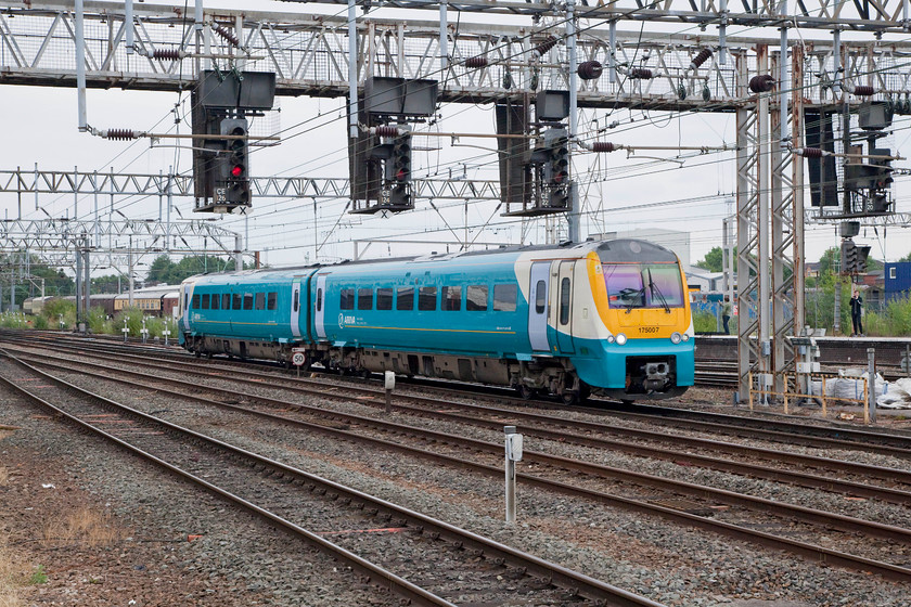 175007, AW 11.09 Carmarthen-Manchester Piccadilly (1W15, 3L), Crewe station 
 175007 arrives into Crewe under the complex infrastructure of wires and supporting structures to the south of the station. This two-car Arriva Trains working, the 1W15 11.09 from Carmarthen to Manchester Piccadilly. 
 Keywords: 175007 1W15 Crewe station