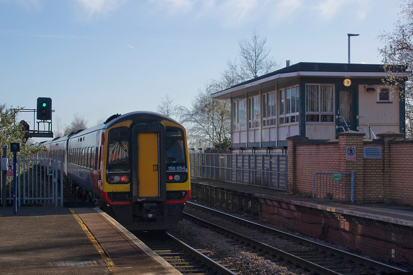 158770 & 158854, EM 08.52 Liverpool Lime Street-Norwich (1L97, 2L), Warrington Central station 
 East Midlands 158770 and 158854 leave Warrington Central station with the 08.52 Liverpool Lime Street to Norwich. I had just alighted from this train having travelled the relatively short distance from Liverpool South Parkway. I was keen to make this short journey as it was virgin track for me, only wishing that I could have travelled further along it to Manchester. To the right is Warrington Central's 1973 BR (London Midland) Type 15 signal box. When it opened, it led to to the closure of four other boxes, Bewsey, Warrington Sidings, Warrington Workshops, and the original Warrington Central. In common with the practice of the time, the box was second-hand with the top previously in use at Newton-le-Willows and the lever frame coming from Wigan's Platt Bridge Junction signal box. 
 Keywords: 158770 158854 08.52 Liverpool Lime Street-Norwich 1L97 Warrington Central station