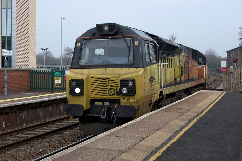 70813, 10.21 Doncaster CHS-Bescot Yard (12E), Newark Castle station 
 70013 runs light engine through Newark Castle station as the 10.21 Doncaster to Bescot light engine move. This particular Colas Class 70 looks very tatty, as do most of their locomotives, with their fleet being involved exclusively on freight and infrastructure work. 
 Keywords: 70813 10.21 Doncaster CHS-Bescot Yard Newark Castle station Colas Rail