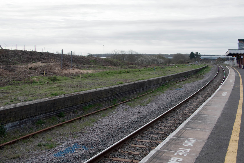 Former platform five, Wellingborough station 
 The cleared expanse of the old platform five at Wellingborough station. Over the coming few years, this scene will be transformed as the platform is brought back into use with the footbridge extended from the station and a whole new entrance and car park built on the land behind the bank. This is all part of the Stanton Cross housing scheme that will transform the somewhat Cinderella like town of Wellingborough. 
 Keywords: Former platform five Wellingborough station