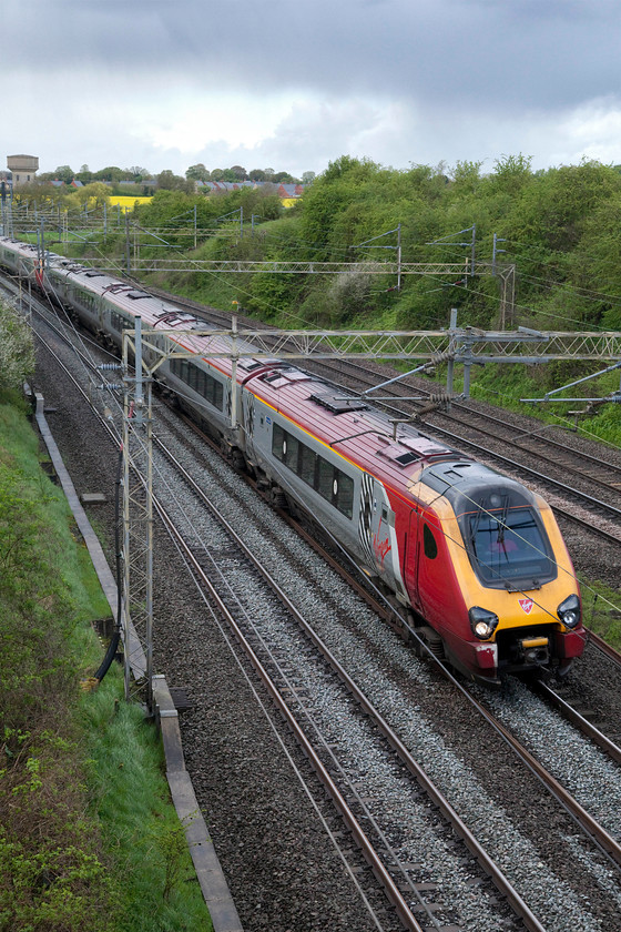 Class 221s, VT 13.48 Holyhead-London Euston (1A48, 2L), Victoria Bridge 
 The rain drops were just beginning to fall now as two unidentified Virgin class 221s race past Victoria Bridge between Northampton and Milton Keynes working the 13.48 Holyhead to London Euston. Another failure to record the numbers of these units due to their small and inconveniently positioned numbers on the lower bodysides. 
 Keywords: Class 221 1A48 Victoria Bridge