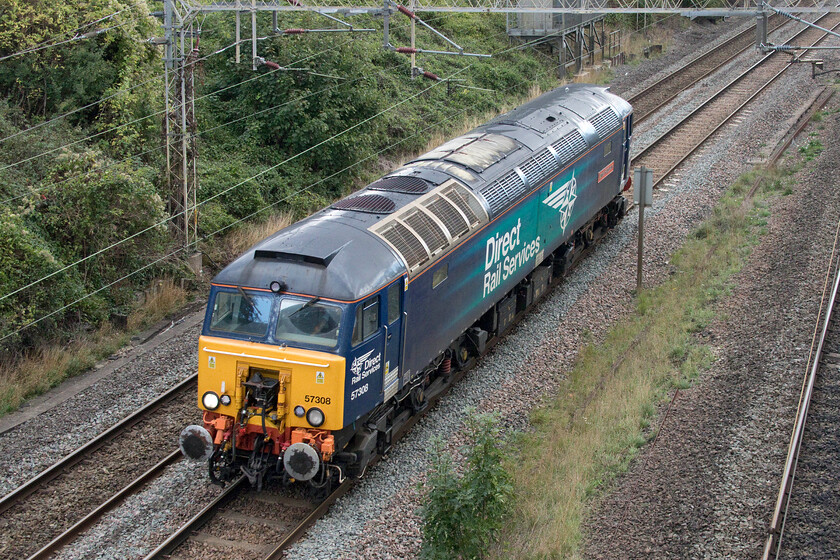 57308, 12.00 London Euston-Rugby (0Z57, RT), Victoria bridge 
 DRS frequently rotates and moves its Thunderbird Class 57s from location to location on the route of the WCML. I have not photographed these moves very often so was pleased to see 0Z57 running on RTT at about the same time that I was out on the lineside with my camera. 57308 'Jamie Ferguson' is seen about to pass under Victoria bridge in South Northamptonshire as the 12.00 Euston to Rugby move. 
 Keywords: 57308 12.00 London Euston-Rugby 0Z57 Victoria bridge Thunderbird Jamie Ferguson