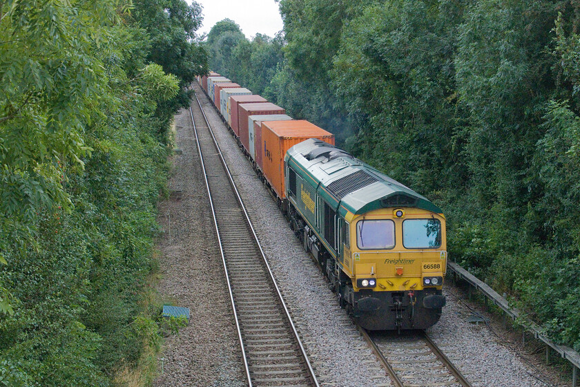 66588, 10.49 London Gateway-Leeds F.L.T ( 4E24, 2L), South Fen Road, Helpringham. 
 The line between Spalding and Sleaford then onwards to Lincoln passes through an extremely rural landscape that, whilst not technically in the Fens is extremely flat and featureless. 66588 leads the 4E24 10.49 London Gateway to Leeds Freightliner through Helpringham. My last visit to this village was in 1980 when Graham and I surveyed the line between Sleaford and Spalding finding a signal box at the site of the old station, see... https://www.ontheupfast.com/p/21936chg/29682545804/helprinham-signal-box-great-eastern 
 Keywords: 66588 10.49 London Gateway-Leeds F.L.T 4E24 South Fen Road Helpringham