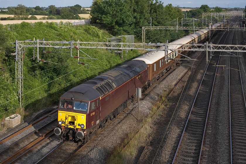 57315, return leg of The Royal Windsor Statesman, Windsor & Eton Riverside-Crewe (1Z57), Victoria bridge 
 Even in strong evening summer sunshine, West Coast Railway's 57315 looks somewhat bland in its drab livery. It is also a shame that the operator did not prepare the locomotive for its railtour duties by giving it a clean! It is seen passing Victoria bridge between Northampton and Milton Keynes with the return 1Z57 return Royal Windsor Statesmen charter from Windsor and Eaton Riverside to Crewe. 
 Keywords: 57315 The Royal Windsor Statesman Windsor & Eton Riverside-Crewe 1Z57 Victoria bridge