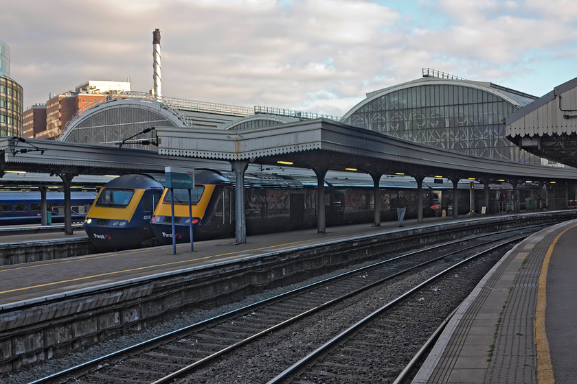 43141, GW 14.05 London Paddington-Penzance (1C85) & 43133, GW 12.00 Bristol Temple Meads-London Paddington, London Paddington station 
 Under threatening skies at Paddington station, 43141 and 43133 stand side by side. The former will lead the 14.05 to Penance whereas the latter has arrived at the rear of the 12.00 from Bristol Temple Meads. This picture shows off some of the wonderful design features of Paddington station such as the superb wrought ironwork behind the vertical glazing. 
 Keywords: 43141 14.05 London Paddington-Penzance 1C85 43133 12.00 Bristol Temple Meads-London Paddington London Paddington station