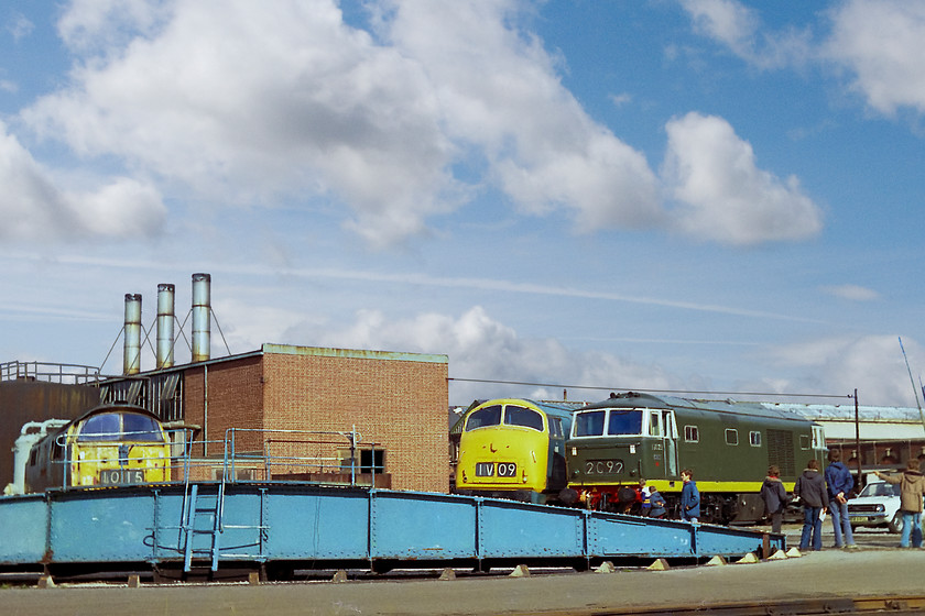 D1015, D818 & D7029, turntable, Swindon Works 
 Grouped around the turntable at Swindon Works is a fine trio of hydraulics! D1015 'Western Champion' is to the left. It was in the care of the DTG and remains part of their collection today. At the time of writing, in 2018, it is undergoing a protracted and expensive engine rebuild so it can return to service and, possibly, the mainline again. D818 'Glory' was not as good inside as the exterior would suggest. It was just a display engine and over the next few years it deteriorated badly to point, after it was stripped for parts for D821, it was scrapped. D7029 is also the property of the DTG and is in service today and can be found on various preserved lines. Finally, as for the white Morris Marina TC to the far right, I suspect that the tin-worm destroyed this too within a few years of this picture!