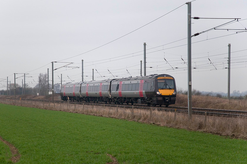 170105, XC 07.22 Birmingham New Street-Stansted Airport (1L30, 30L), Woodcroft Crossing TF139050 
 Cross Country's 170105 approaches Woodcroft level crossing on the approaches to Peterborough. This three-car 170 was working the 07.22 Birmingham New Street to Stansted Airport. Something had obviously gone wrong as it was late here and eventually arrived at its destination half an hour adrift. 
 Keywords: 170105 1L30 Woodcroft Crossing TF139050