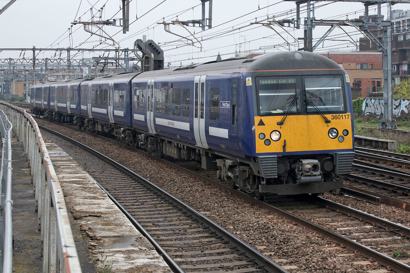 360117, LE 1.52 Ipswich-London Liverpool Street (1Y39, 1E), Bethnal Green station 
 Despite being identical to the class 350 Desiros apart from lacking the inter-connecting doors, in my mind the class 360s look totally different; it's strange how the eye and brain perceives an object. Greater Anglia operated 360117 passes Bethnal Green on the GEML working the 13.52 Ipswich to Liverpool Street. Along with the older class 31X units, these 360s will be withdrawn from this route soon as the class 710s are introduced. However, the class 360s are likely to find work elsewhere where as the veteran class 31Xs will be withdrawn and cut-up. 
 Keywords: 360117 13.52 Ipswich-London Liverpool Street 1Y39 Bethnal Green station