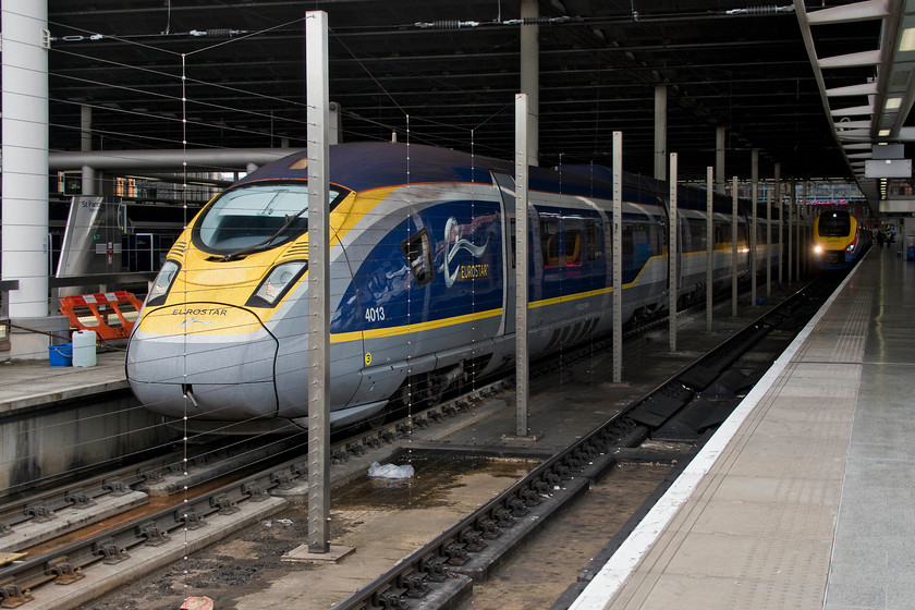 374013, ES 14.04 London St. Pancras International-Brussels Midi (9136) & 222016, EM 13.47 London St. Pancras-Corby (1M28, RT), London St. Pancras station 
 The 14.04 Eurostar service to Brussels Midi waits at platform five of St. Pancras International station to be worked by 374013. This is one of seventeen members of this class that was introduced in 2015. I must admit, I do not think that the 374s are as good looking as the ageing class 373s. Next to the Eurostar at platform four is 222016 that is about to leave with the far less exotic 13.47 to Corby. 
 Keywords: 374013 14.04 London St. Pancras International-Brussels Midi 9136 222016 13.47 London St. Pancras-Corby 1M28 London St. Pancras station