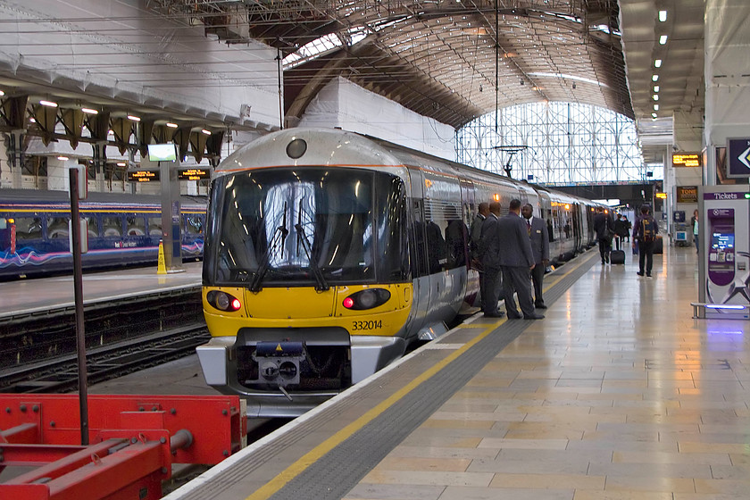 332014, HX 09.55 London Paddington-Heathrow Airport T5 (1T43), London Paddington station 
 Having travelled on the continent and used trains to a form airports I have found most quick, efficient and good value. However, the fares charged by Heathrow Express to get to and from Central London are a complete embarrassment. It's an absolute scandal that jet-lagged visitors arrive having had a long overnight flight are then charged 30 to get into London to complete their journey; welcome to rip-off Britain! Some of this huge amount of money probably pays staff as witnessed here with no fewer than four HX employees chatting next to 332014 that will soon work the 09.55 to Heathrow's Terminal five. 
 Keywords: 332014 09.55 London Paddington-Heathrow Airport T5 1T43 London Paddington station