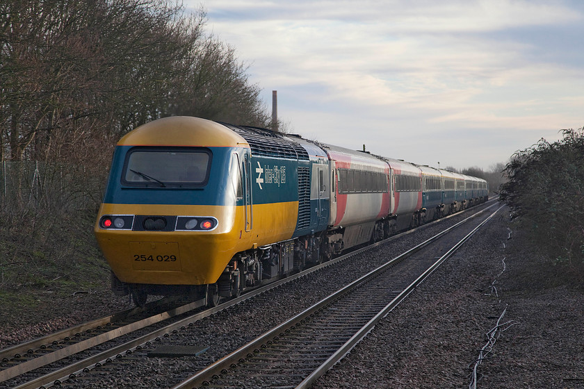 43006 & 43206, 04.41 Craigentinny-Ely Papworth Sidings (5L46), Kings Dyke crossing 
 This really is it.......the final day of 2019 and the curtain is brought down on ECML HST operations with the celebrity EC56 set, with the addition of two other LNER branded coaches, moving for storage at Ely. Into the final few miles of its journey from Scotland 43206, wearing set number 254029, passes Kings Dyke crossing on the Fens. The empty coaching stock move ran as 5L46 leaving Craigentinny at 04.41 for Ely. 
 Keywords: 43206 43006 04.41 Craigentinny-Ely Papworth Sidings 5L46 Kings Dyke crossing HST