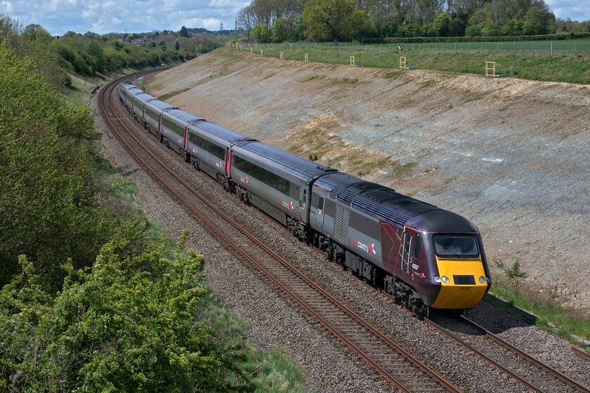 43207 & 43239, XC (For GW) 12.30 Bristol Temple Meads-Swindon (1Z20, RT), Thingley ST890700 
 HSTs return to the Great Western Mainline again! After a break of some two years, GWR has been forced to reintroduce HSTs to the route once again after their new and shiny Class 800s had to be taken out of service following safety checks revealing cracks to their aluminium underframes. A CrossCountry set has been hired in by GWR with 43207 leading 43239 operating the 12.30 Bristol Temple Meads to Swindon shuttle operating as 1Z20 seen approaching Thingley Junction just west of Chippenham. Once at Swindon, passengers will change boarding an electric Class 387 service towards London. There have been questions asked about the possible use of the GWR Castle sets to run through to London but, according to Rail (issue 931), there are gauging issues now further east towards the capital. 
 Keywords: 43207 43239 12.30 Bristol Temple Meads-Swindon 1Z20 Thingley ST890700 CrossCountry HST GWR Great Western Railway HST