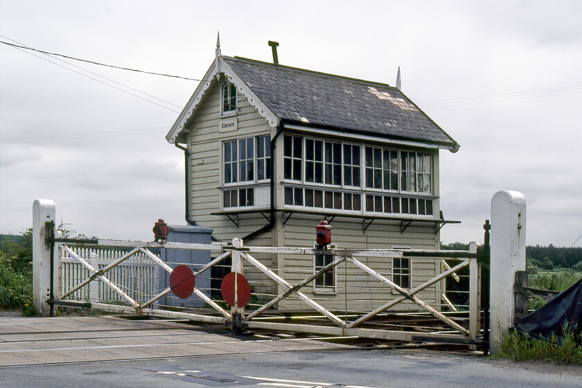 Elsham signal box (MS&L, 1885) 
 Elsham signal box is seen complete with its wooden gates that were removed in the early 2000s to be replaced by the inevitable barriers. Located between Brigg and Barnetby the box was commissioned by the Manchester, Sheffield and Lincolnshire Railway Company being constructed by Railway Signal Company of Fazakerley, Liverpool in 1885. Today it still stands and is one of a number of Grade II listed boxes designated by Historic England. In their citation, they state that it is included 'as a representative example of the standard design of signal box (used 1881-1923) of the most successful signalling firm of the later pre-grouping period'. 
 Keywords: Elsham signal box MS&L 1885