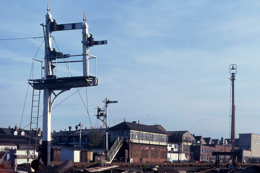 Cricklewood Junction signal box (LMS, c1929) 
 In the beautiful afternoon winter sun, Cricklewood signal box is seen just north of the station. It was a one hundred and twenty lever LMS box dating from circa 1929. As well as controlling the Midland Mainline it also permitted access to and from the busy depot. Finally, it had control over the junction to the Dudding Hill and West London line along with many sidings. Notice the superb Midland wooden signal in the foreground and the substantial Express dairy behind the box. This has now been demolished and is home to a housing estate with the access road aptly called Dairyman Close leading into it off Claremont Road. 
 Keywords: Cricklewood Junction signal box