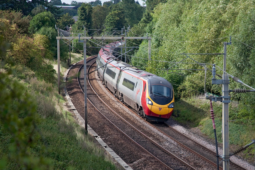 390115, VT 14.15 Manchester Piccadilly-London Euston (1A42, 10L), Weedon SP635589 
 350115 forms the 14.15 Manchester Piccadilly to London Euston and is seen taking the final curve of Weedon's infamous reverse curves before joining some relatively straighter sections south towards Roade. 
 Keywords: 390115 1A42 Weedon SP635589