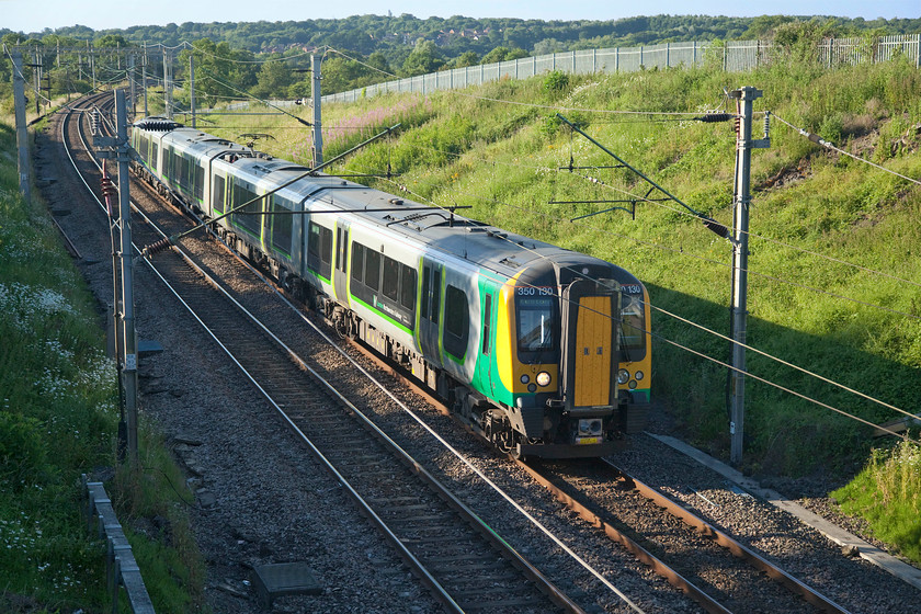 350130, LN 16.05 Liverpool Lime Street-London Euston (9Y20, 4L), Milton Malsor SP738560 
 In bright early evening sunlight, 350130 leaves Northampton behind as it approaches Milton Malsor working the 9Y20 16.05 Liverpool Lime Street to Euston service. Since the new timetable was introduced in May, Northampton (and a number of other stations) now enjoy direct trains to and from Merseyside for the first time in many years. 
 Keywords: 350130 16.05 Liverpool Lime Street-London Euston 9Y20 Milton Malsor SP738560