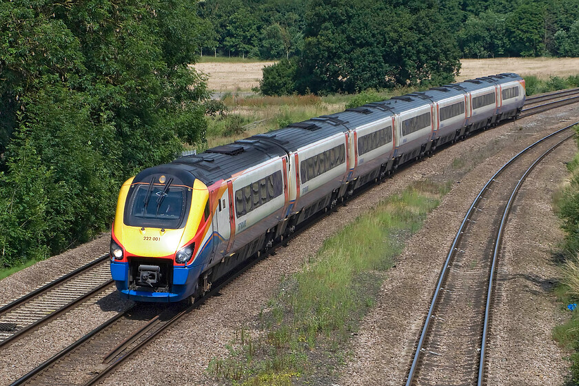 222001, EM 09.29 Sheffield-London St. Pancras (1C30), Finedon Road industrial estate SP900702 
 Pioneer Meridian 222001 approaches Wellingborough from the north working the 09.29 Sheffield to St. Pancras East Midlands Railway service. These units were introduced at the start of the summer timetable exactly ten years ago to replace the wholly inadequate Class 170 Turbostar units. They have settled in well and are reliable units but one cannot help but think about what will happen when the line is electrified from 2020 and where they may go next? 
 Keywords: 222001 09.29 Sheffield-London St. Pancras 1C30 Finedon Road industrial estate SP900702 EMR East Midlands Railway Meridian