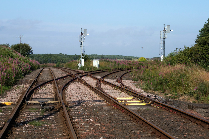 Winning Junction 
 Winning Junction, seen from the level crossing with the signal box directly behind where I am standing. To the right is the chord that leads to the Ashington and Lynmouth line that it joins a short distance away at Marchey`s House. Straight ahead is the southern chord that leads to the same line that heads south towards Beddlington. 
 Keywords: Winning Junction