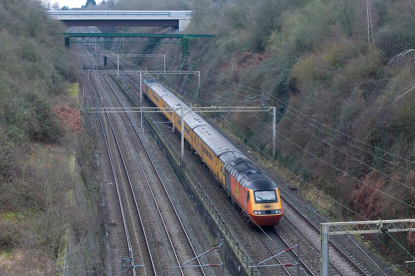 43277 & 43257, 11.37 Crewe Pottery Sidings-Derby RTC (1Q85, 1E), Roade cutting 
 43277 'Safety Task Force' brings up the rear of the 11.37 Crewe Pottery Sidings to Derby RTC measurement train passes through Roade cutting. Matching Colas power car 43257 is leading the 1Q85 at the front of the train. Close examination of the rear power car reveals some wag has written 'clean me' in the grime of the nose cone just under the small Colas logo! 
 Keywords: Safety Task Force 43277 43257 11.37 Crewe Pottery Sidings-Derby RTC 1Q85 Roade cutting NMT Network Rail HST Colas