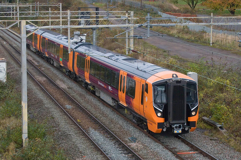 730010, 12.33 London Euston-Bletchley (via Northampton) (5Q86, 30E), site of Roade station 
 I could find nothing about this Sunday morning run from Euston to Bletchley via reversal in Northampton's Riverside sidings. 730010 is seen passing through Roade on its final leg to Bletchley running as 5Q86. It was probably a driver training run of some kind rather than mileage accumulation or testing as this unit was the one that operated London Northwestern's first Class 730 service at the start of the week, see... https://www.railadvent.co.uk/2023/11/new-class-730-trains-enter-service-with-london-northwestern-railway.html 
 Keywords: 730010 12.33 London Euston-Bletchley via Northampton 5Q86 site of Roade station West Midlands Trains