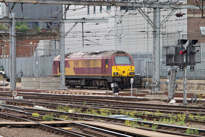 67023, stabled, London Kings Cross station 
 67023 waits for the call in its stabling siding at London King's Cross station. The large building behind the 67 is the new King's Cross signalling centre, what you and I would call a signal box but on a larger scale! 
 Keywords: 67023 London Kings Cross station