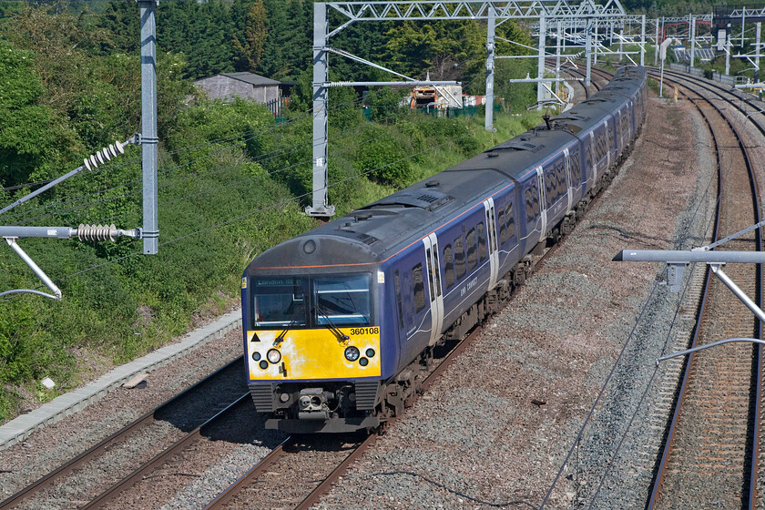 360108 & 360111, EM 08.40 Corby-London St. Pancras (1H21, 5L), Sharnbrook TL001598 
 Despite some work to 'refresh' the former Greater Anglia Desiros, nobody thought it appropriate to repaint the front ends; not a great message being sent to the travellers on the MML especially post COVID! 360108 and 360111 work the 1H21 08.40 Corby to St. Pancras train on the approach to Sharbrook Junction. 
 Keywords: 360108 360111, EM 08.40 Corby-London St. Pancras 1H21 Sharnbrook TL001598 EMR Connect Desiro