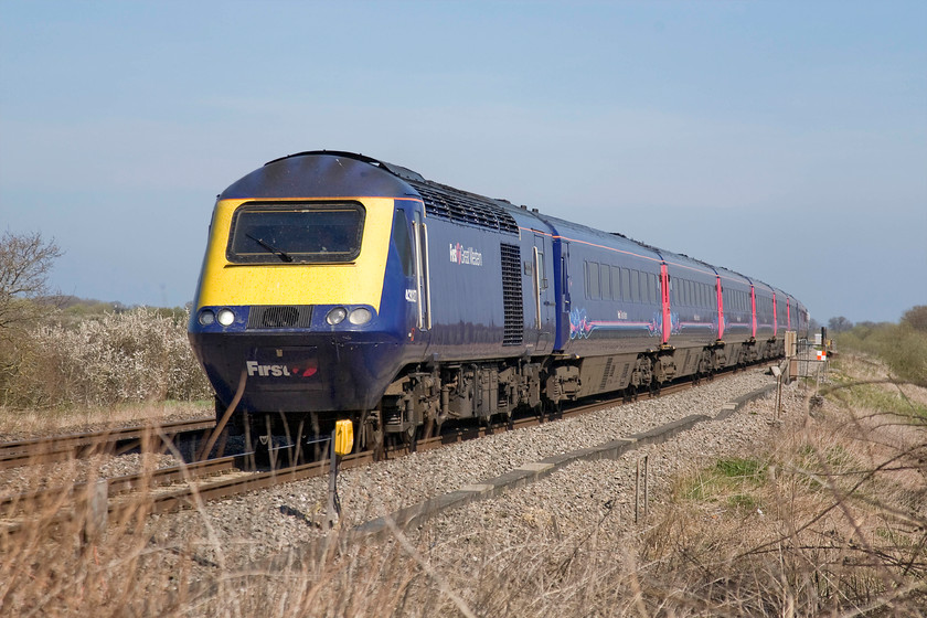 43027, GW 12.15 London Paddington-Cardiff Central (1B31), Knighton crossing SU276890 
 One cannot deny what a fine sight an hst is in full flight doing exactly what it was designed for namely, working at full chat on the GWML! 43027 'Glorious Devon', one of the first batch of Western Region power cars introduced as part of set 253013, leads the 12.15 Paddington to Cardiff 1B31 service. This is something that is has done nearly forty years now but is one that will come to an end soon with the electrification of the line to Bristol and Swansea. 
 Keywords: 43027 12.15 London Paddington-Cardiff Central 1B31 Knighton crossing SU276890