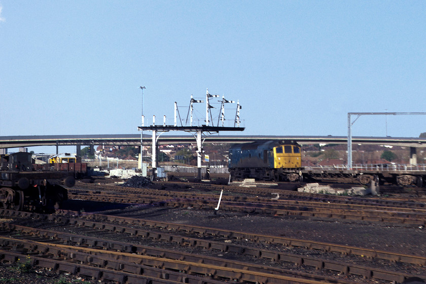 25178, PW train, Brent yard TQ231867 
 25178 trundles about doing its business in Brent yard. It is just in front of a lovely timber Midland gantry located at the north end of the yard. 25178 was a Derby built locomotive that was released to traffic in 1965 and withdrawn twenty years later in 1985. Beyond, in the distance, is the viaduct that spans the yard carrying the A406 North Circular road, the bane of so many Londoners' lives! 
 Keywords: 25178 Brent yard TQ231867