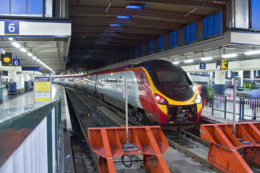 390138, VT 19.43 London Euston-Preston (9P42), London Euston station 
 One of the named Pendolinos, 390138 'City of London' will leave Euston a few minutes before our train home will do so with the 9P42 19.43 to Preston. Another example of a Class 390 running about with its coupling cover door in its retracted position, not that this will have much of an effect on its aerodynamics when at the rear of the train as in this particular case. 
 Keywords: 390138 19.43 London Euston-Preston 9P42 London Euston station Virgin Trains Pendolino City of London