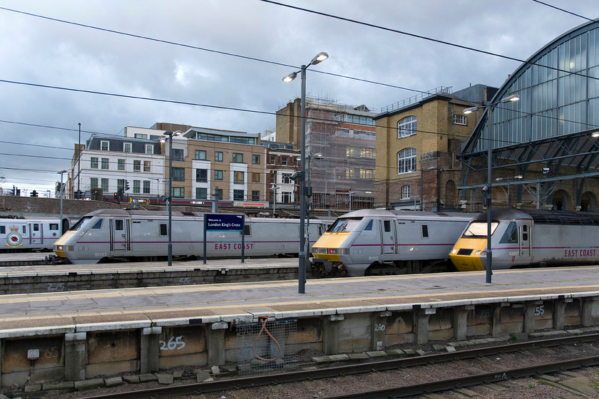 91110, GR 17.30 London King's Cross-Newcastle, (1N27), 91132, GR 17.03 London King's Cross-Leeds (1D23), 91113 & 43307, London KIng's Cross station 
 A late afternoon line up at King's Cross sees some of East Coast's finest machinery awaiting their next turn of duty. To the far left is 91110 'Battle of Britain Memorial Flight' waiting to work the 17.30 to Newcastle. Next is 91132 that is just getting away on time with the 17.03 to Leeds. 91113 has recently arrived with a service from the north with 43307 (formally 43107) having done the same a short time earlier. I cannot help but feel that the rather monotonous blue shade of grey of East Coast is a little dull but it is a state-owned public sector operation so it is not surprising really is it! 
 Keywords: 91110 17.30 London King's Cross-Newcastle 1N27 91132 17.03 London King's Cross-Leeds 1D23 91113 43307 London KIng's Cross station Battle of Britain Memorial Flight