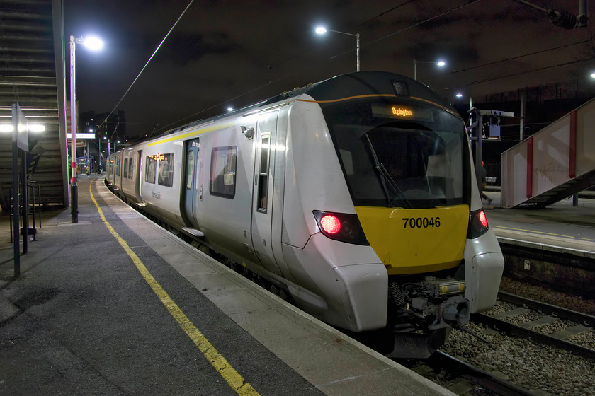 700046, TL 18.32 Luton-Orpington (9L57, 5L), Kentish Town station 
 Having alighted from 700046 at Kentish Town I managed a photograph of the train in the darkness on the platform end just as the train began to leave. Under modern LED lighting photographs like this are possible without the orange hue from sodium lights or the green colouration from fluorescents. We had travelled down from Elstree and Borehamwood on this unit in order to change to a London Underground service at the linked station. This was part of one continuous Oyster card journey from when we touched in at Elstree and touched out at Leicester Square. 
 Keywords: 700046 18.32 Luton-Orpington 9L57 Kentish Town station Thameslink just as it was moving off. Thanks to the new LED lighting at the station the lighting is bright and very white creating no colour cast to correct as would have been the case with tungsten or fluorescent lighting. My wife and I travelled on this service from Elstree and Borehamwood station and then made the short walk to London Underground's Northern Line station. All this journey was classed as one only tapping in and out at Elstree and Leicester Square stations respectively.