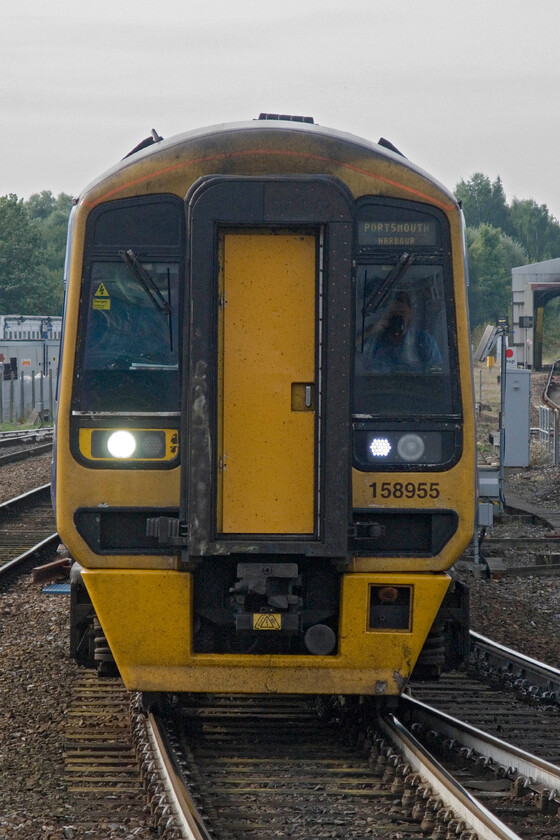 158955, GW 14.02 Bristol Parkway-Portsmouth Harbour (1F19), Salisbury station 
 FGW's 158955 approaches Salisbury station working the 14.02 Bristol Parkway to Portsmouth Harbour service. This severe front-end view reveals the driver taking a swig of his chosen refreshment from what appears to be an insulated mug. 
 Keywords: 158955 14.02 Bristol Parkway-Portsmouth Harbour 1F19 Salisbury station First Great Western