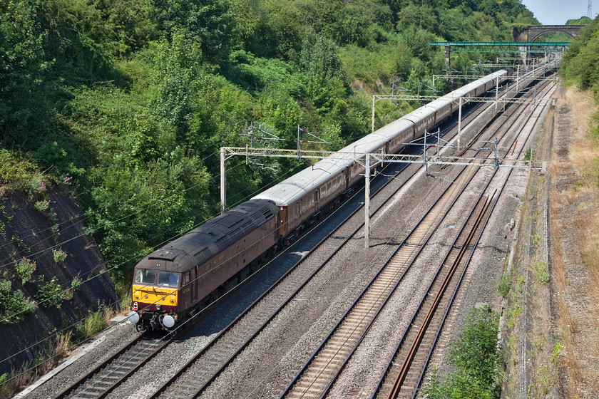 47826 & 47746 12.10 Acton Exchange Sidings-Crewe Carriage Sidings (5Z32), Roade Cutting 
 47826 brings up the rear of the 5Z32 12.10 Acton Exchange Sidings to Crewe Carriage ECS working. The train is seen on the down fast (the Weedon Loop) passing through Roade Cutting as the Northampton line was closed for engineering works. 
 Keywords: 47826 47746 12.10 Acton Exchange Sidings-Crewe Carriage Sidings 5Z32 Roade Cutting