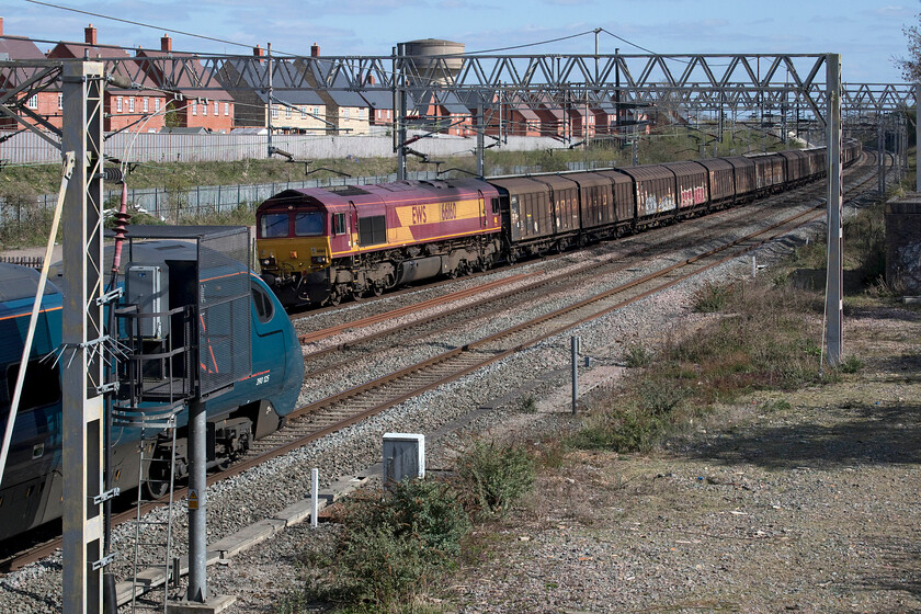 390125, VT 15.04 London Euston-Manchester Piccadilly & 6M45 66160, 11.29 Dollands Moor-DIRFT (6M45, 20E), site of Roade station.jpgn Euston-Manchester Piccadilly (6M45, RT) & 
 Nearly bowled! As the 6M45 'water train' appeared around the curve in the distance led by a rather faded EWS liveried 66160 a Pendolino also burst into view on the down fast line. Thinking it was all over I made the decision to keep the camera to my eye and ended up with this interesting image of the freight as 390125 on the 15.04 Euston to Manchester service just goes out of shot. Interestingly, the same thing happened back in January at the same location but then it did not quite work out, see..... https://www.ontheupfast.com/p/21936chg/29954715604/x390130-12-43-london-euston-edinburgh 
 Keywords: 390125 15.04 London Euston-Manchester Piccadilly 6M45 66160 11.29 Dollands Moor-DIRFT 6C24 site of Roade station EWS DB Avanti West Coast Pendolino