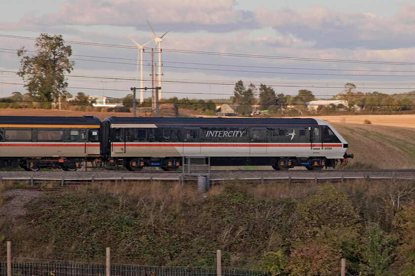 82139, 16.21 Manchester Piccadilly-London Euston (1Z96, 2E), Roade hill 
 With the evening sunshine tantalisingly close 82139 heads southwards leading the 16.21 Manchester Piccadilly to Euston LSL Avanti relief service. It's interesting to note the different shades of white applied to the side of the DVT. I am not sure if these two shades, with the second one extending the length of the Mk. III stock is the same as it was when it was applied by BR in the 1980s and 1990s or simply that a different shade of paint was found! 
 Keywords: 82139 16.21 Manchester Piccadilly-London Euston 1Z96 Roade hill DVT Intercity swallow