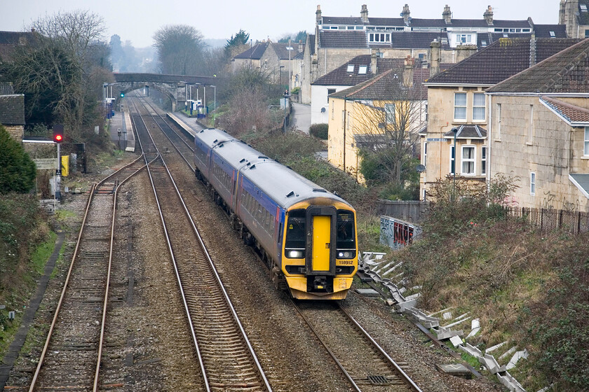 158852, GW 08.30 Cardiff Central-Portsmouth Harbour, Oldfield Park, Brougham Heyes bridge 
 FGW's 158852 passes through the Oldfield Park area west of Bath working the 08.30 Cardiff Central to Portsmouth Harbour service. In my youth when cutting my trainspotting teeth in this area trains such as this were composed of a rake of Mk. 1 stock with a BG marshalled somewhere in the consist topped off with a Class 31 or a 33 hauling. Is a three-car DMU a suitable modern-day replacement; I will leave you to decide! 
 Keywords: 158852 08.30 Cardiff Central-Portsmouth Harbour Oldfield Park Brougham Heyes bridge FGW First Great Western