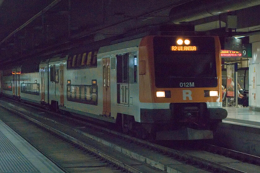 450 012, Rodalies R (Line)2 Vilanova i la Geltr working, Barcelona-Sants station 
 Rather like Birmingham New Street Barcelona-Sants station is an underground station that is also rather dark and oppressive. However, unlike its West Midlands counterpart, it is not plagued by the stench of diesel fumes from idling Voyagers! A Rodalies Class 450 double-decker pauses at Saints station worked by 450 012 on its way to Vilanova i la Geltr, a regional working to a town some twenty miles to the south of Barcelona. 
 Keywords: 012, Rodalies R Line Vilanova i la Geltr working Barcelona-Sants station