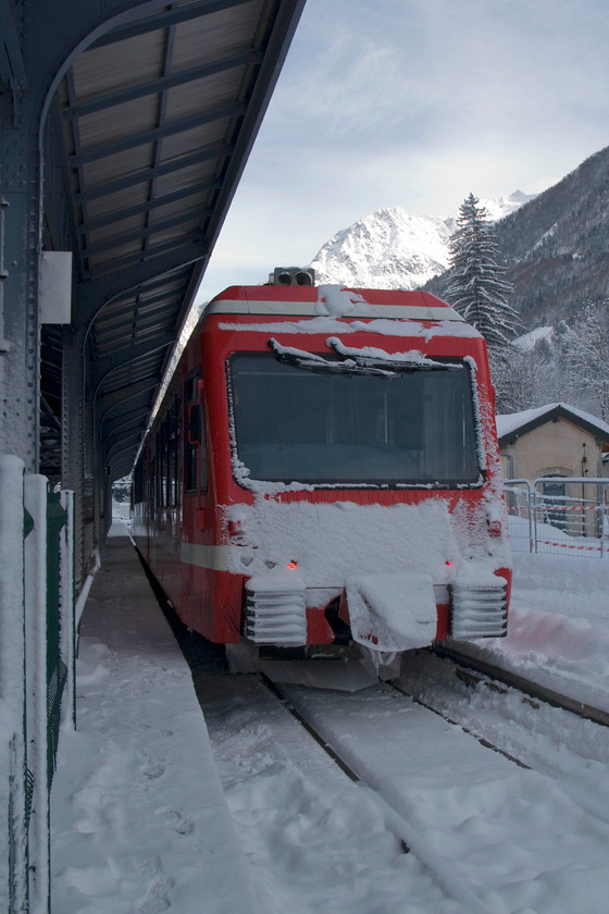 Z851, 11.54 Chamonix Mt. Blanc-Valloricine (18911), Chamoix Mt 
 Three-car EMU Z851 waits at Chamonix station to leave with train 18911, the 11.54 to Valloricine. It is encrusted with snow much of which had fallen the previous night causing even the roads and railways of the Chamonix valley to slow down! In the background is the Grands Montets and just out of view to the right Mt. Blanc, Europe's highest mountain. 
 Keywords: Z851 11.54 Chamonix Mt. Blanc-Valloricine 18911 Chamoix Mt. Blanc station