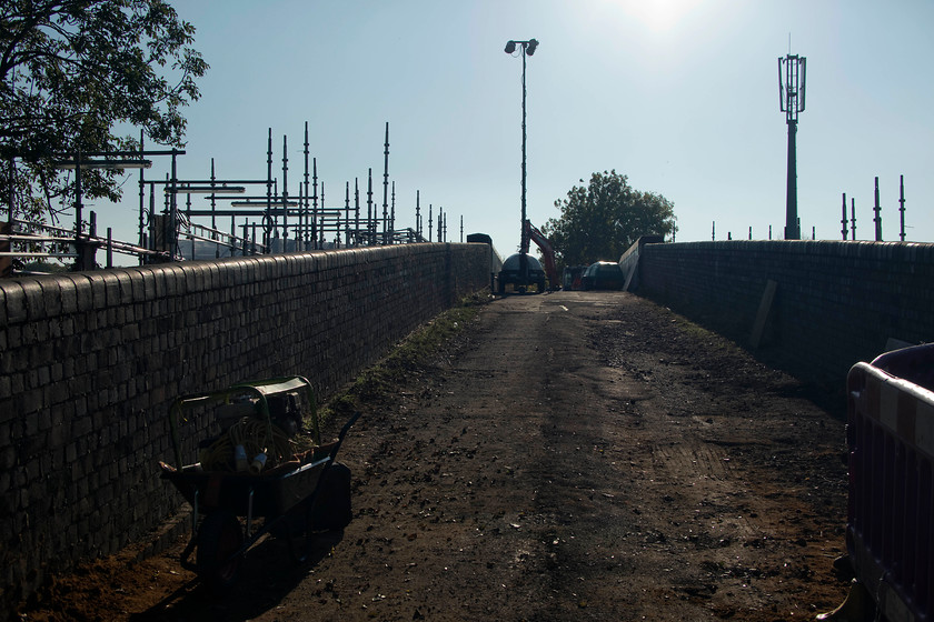 Demolition of Back Lane bridge, Souldrop Back Lane bridge 
 Looking up Back Lane bridge at Souldrop during its partial demolition. To the left are the scaffolding poles that make up the temporary footbridge constructed by Network Rail. 
 Keywords: Demolition of Back Lane bridge Souldrop Back Lane bridge