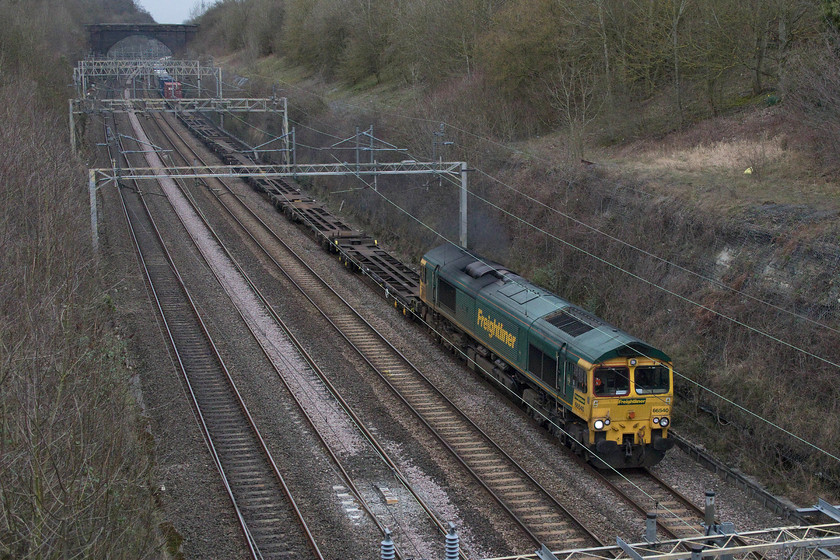 66540, 12.32 Crewe Basford Hall-Wembley yard (4L90), Hyde Road bridge, Roade 
 My afternoon constitutional happened to coincide with the passage through the village of the 12.32 Crewe Basford Hall to Wembley yard Freightliner! 66540 'Ruby' leads the 4L90 bang on-time through Roade about to pass under Hyde Road bridge. Another example of a Freightliner heading in the 'export direction' that is only half loaded 
 Keywords: 66540 12.32 Crewe Basford Hall-Wembley yard 4L90 Hyde Road bridge Roade