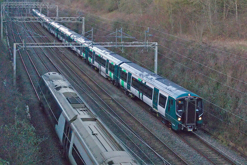 730234 & 730209, 14.01 Crewe-Wembley Yard (2Q94, 7E) & 390123, VT 14.33 London Euston-Liverpool Lime Street (1H69, 31L), Hyde Road bridge 
 Getting ready to enter service 730234 and 730209 head south through Roade cutting as the 2Q94 14.01 Crewe to Wembley Yard run. Soon, these smart new trains will enter service with London Northwestern on this route with the 350/2 subset going off-lease. As the train passes, 390123 heads north working the 14.33 Euston to Liverpool service. 
 Keywords: 730234 730209 14.01 Crewe-Wembley Yard 2Q94 390123 14.33 London Euston-Liverpool Lime Street 1H69 Hyde Road bridge